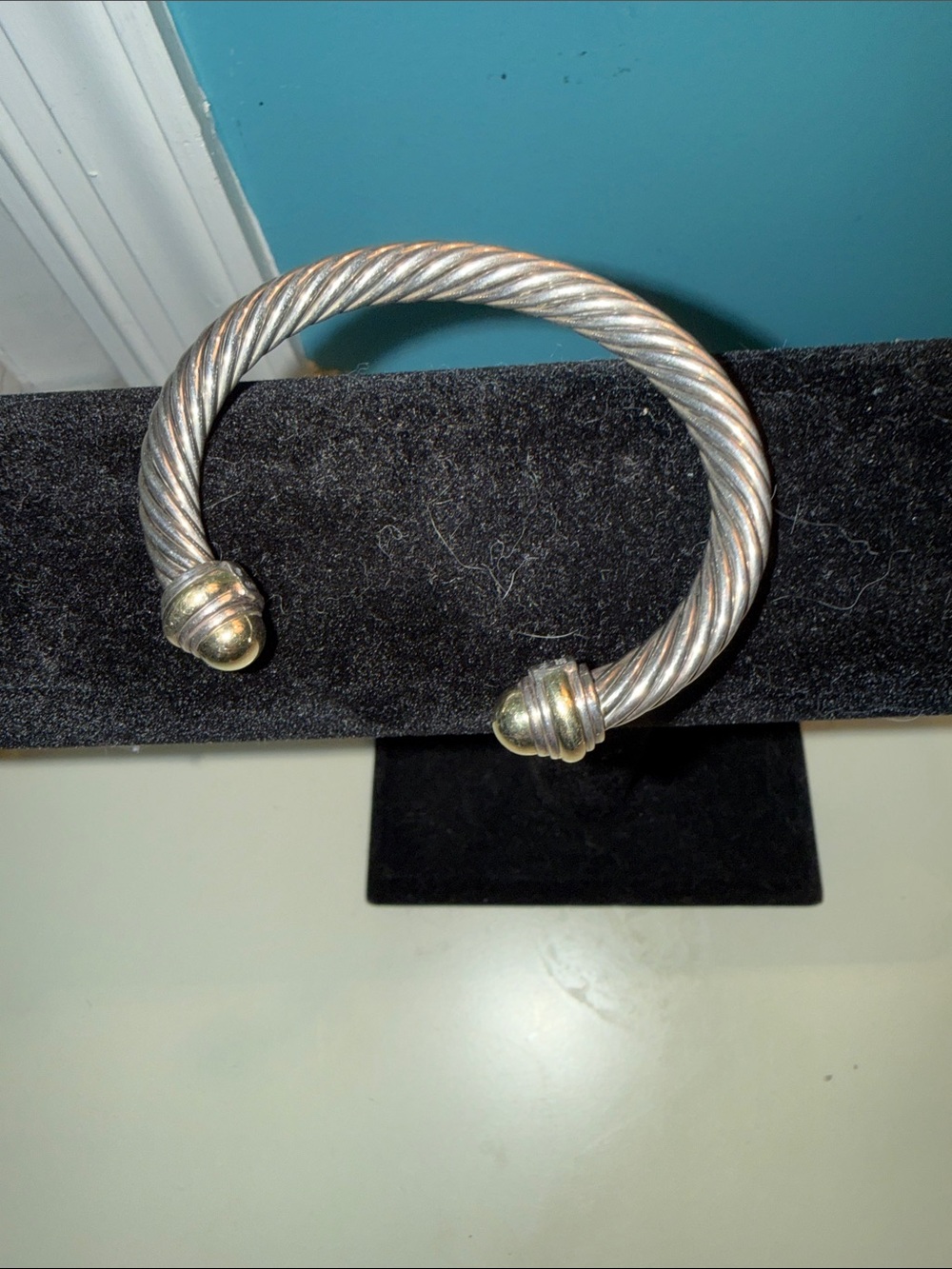 David Yurman Cable Classic bracelet in sterling silver with 14k gold dome tips.